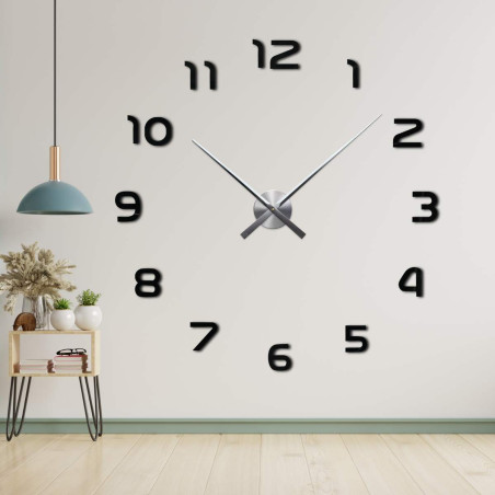 Zegar bezramkowy z centralnym mechanizmem i długimi wskazówkami.